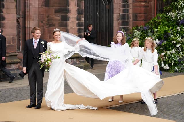 Olivia and Hugh outside Chester Cathedral with three  young guests. Photo: Peter Byrne/PA Wire
