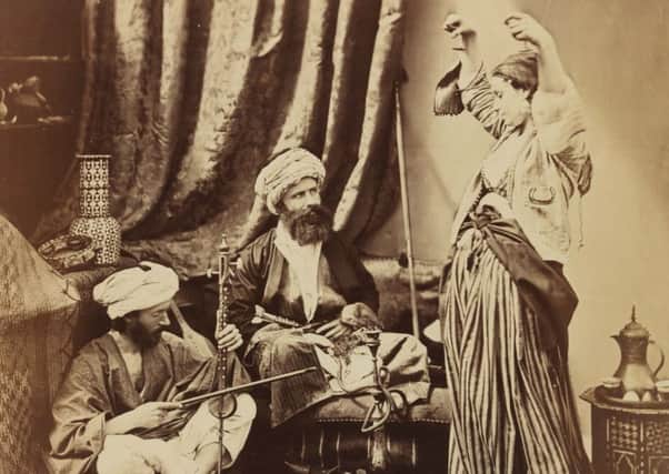 Pasha and BayadÃ¨re, by Preston photographer Roger Fenton, depicts a dancing girl (bayadÃ¨re) performing for the enjoyment of a high ranking official (pasha), who watches her intently.
From National Media Museum